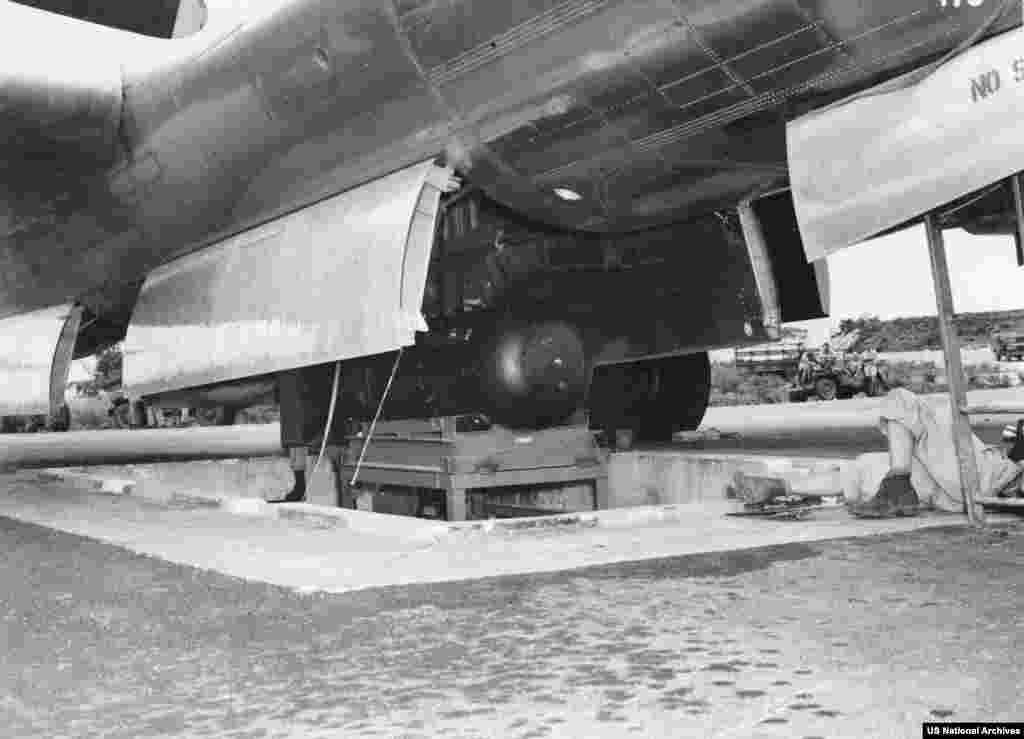 "Little Boy" being loaded aboard the Enola Gay on Tinian Island.The assembled bomb was loaded onto the Enola Gay, a B-29 named after the mother of its pilot, Colonel Paul Tibbets, on August 5, 1945, from a special pit built into Tinian’s North Airfield. The plane took off for Japan the following morning.