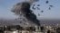 Smoke rises following an air strike in Mosul on March 6, during an offensive by Iraqi forces to retake the western parts of the city from the militant Islamic State group. 