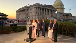 US representatives speak to journalists outside the US Capitol in Washington after the bill aiming to impose sanctions on Russia and Iran passed the House on September 16.
