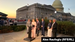 US representatives speak to journalists outside the US Capitol in Washington after the bill aiming to impose sanctions on Russia and Iran passed the House on September 16.