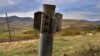 NAGORNO-KARABAKH -- A fragment of a Smerch rocket sticks out of the ground near the town of Martuni, October 26, 2020