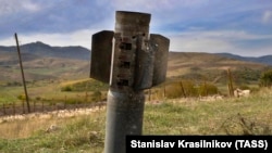 NAGORNO-KARABAKH -- A fragment of a Smerch rocket sticks out of the ground near the town of Martuni, October 26, 2020