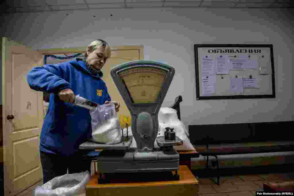 Basic food supplies brought from Russia are repackaged at the aid distribution center.