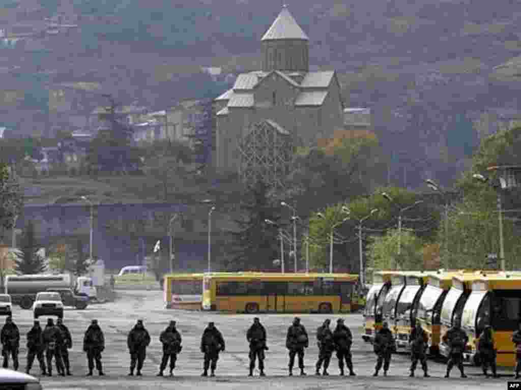 Georgian soldiers patrol a street in central Tbilisi on November 9, 2007. Georgian President Mikheil Saakashvili's chief of staff said that a nationwide state of emergency in Georgia will be lifted earlier than planned. Friday afternoon the Georgian parliament voted 149 to 0 in favor of endorsing the president's emergency decree.