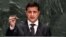 Ukrainian President Volodymyr Zelensky holds a bullet as he addresses the United Nations General Assembly in New York.