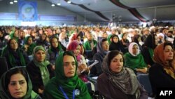 Female delegates listen to Afghan President Hamid Karzai's speech at the start of the peace jirga. Nearly one-fifth of the jirga's 1,600 delegates are women.