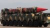 Pakistani military personnel stand beside a Shaheen-III surface-to-surface ballistic missile during a military parade. (file photo)