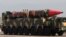 Pakistani military personnel stand beside a Shaheen-III surface-to-surface ballistic missile during a military parade. (file photo)