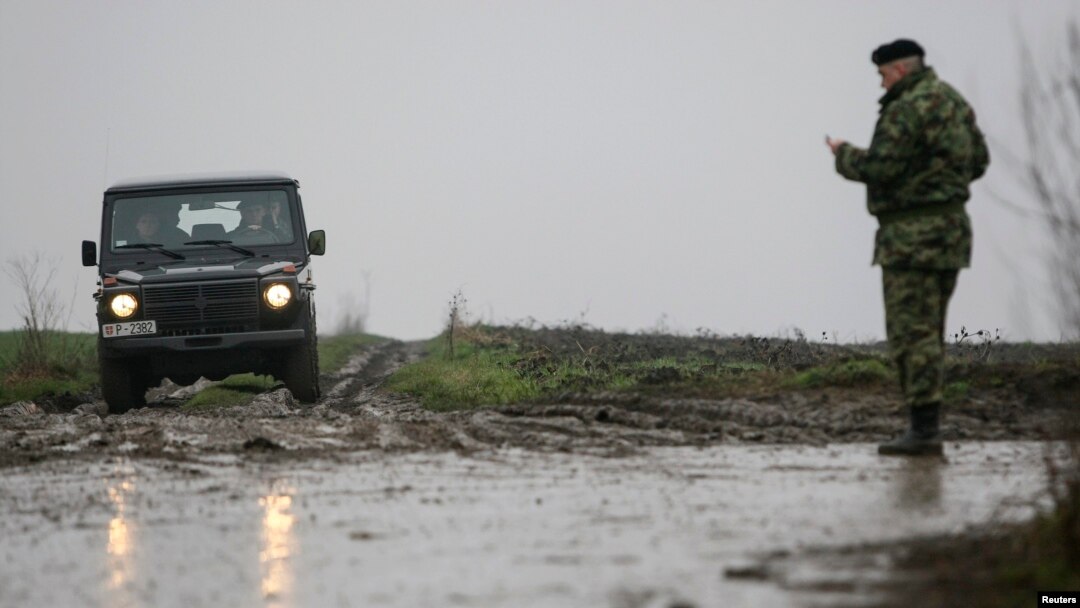 Serbian soldiers at the scene of a military helicopter crash near Belgrade Airport on March 14.