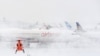 Stiff Upper Lip In Moscow As London Airports Paralyzed By Snow