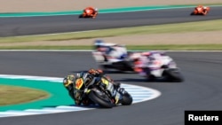 MotoGP racers round a turn at the Japanese Grand Prix in Motegi, Japan, on September 25. 