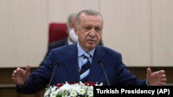 CYPRUS -- Turkey's President Recep Tayyip Erdogan addresses the Turkish Cypriot Parliament, in Nicosia, July 19, 2021. 