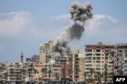 Smoke rises following an Israeli air strike on Tyre on June 9.