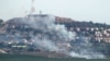 Слупы дыму ў паўночным ізраільскім горадзе Метула ад ракет, выпушчаных з Лібана 26 чэрвеня 2024