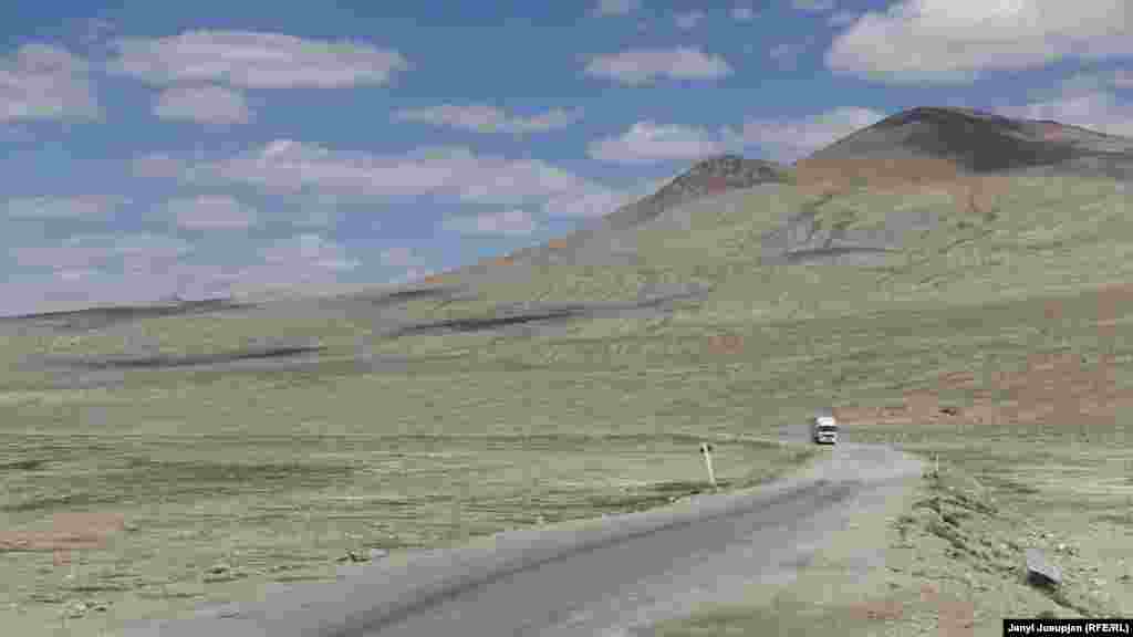 A Chinese truck on the road near Alichor. They pass this way en route to Dushanbe, which brings an added benefit as drivers sometimes stop by for lunch in a local canteen.