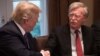 File photo - U.S. President Donald Trump shakes hands with National Security Advisor John Bolto during a meeting with senior military leaders at the White House in Washington, April 9, 2018