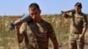 Ukrainian soldiers carry mortar shells during a military exercise in the Kherson region on August 1.