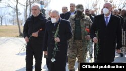 Armenia -- Defense Minister Vagharshak Harutiunian and other officials visit the Yerablur Military Pantheon in Yerevan, March 5, 2021.