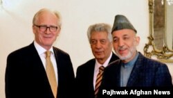 UN envoy Kai Eide (left) has called on Afghan President Hamid Karzai's next government "should be composed of competent, reform-oriented personalities that can implement a reform agenda." 