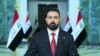 Iraqi Prime Minister Ali al-Zaidi delivers a televised address after assuming office, in Baghdad