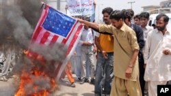 Supporters of Pakistan's Muslim League burn a representation of the U.S flag during an anti-American demonstration in May.