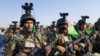 FILE: Afghan National Army soldiers prepare for an operation in the northern province of Balkh in February.