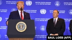 U.S. President Donald Trump (left) speaks to a press conference in New York in September 19 as Secretary of State Mike Pompeo looks on.