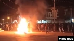  Iranian protesters burn tires in the city of Kavar in Fars Province on January 1.