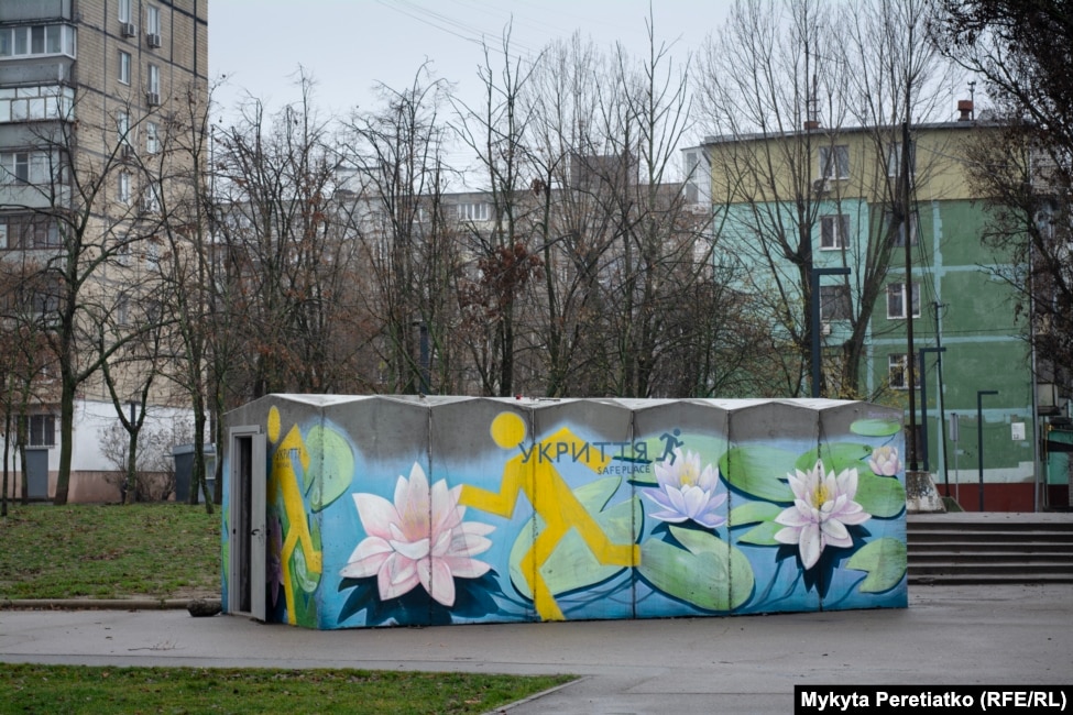 A shelter with flowers painted on it stands amid residential buildings in Dnipro on December 12