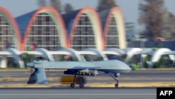 An MQ-1B Predator aircraft assigned to the 62nd Expeditionary Reconnaissance Squadron lands at Kandahar Airfield on August 13.