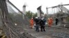 Rescue workers at the scene of the collapse on October 25.