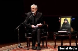 Gholamali Haddad Adel attends a memorial service for his daughter Zahra Haddad Adel (pictured in the photograph), who was killed in an air strike on February 28.