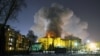 Smoke rises above the multistory shopping center in the Siberian city of Kemerovo on March 25.