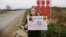 Ангелина Иванова с плакатом против полигона