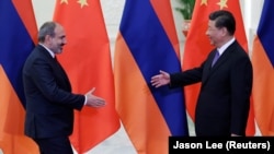 CHINA -- Chinese President Xi Jinping (R) meets Armenian Prime Minister Nikol Pashinian at the Great Hall of the People, in Beijing, May 14, 2019