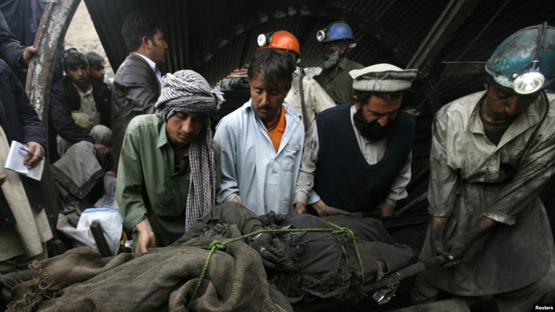 Rescue workers retrieve the body of one of the miners who was killed on March 20.