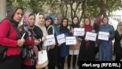 FILE: A journalists protest in northern Afghanistan.