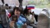 В сюжетах медиа группировок «ЛДНР» все ехавшие на голосование в Россию были счастливы, снабжены флажками и готовы говорить на камеру, что это для них честь