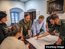 A team plans a 3-D scan of a historic shipwreck in Zaporizhzhya during work on the Our Land virtual museum.