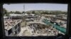 FILE: Workers remove debris from a damaged area a day after a suicide bomb attack near the foreign embassies in Kabul.