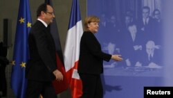 Канцлер Германии Ангела Меркель и президент Франции Франсуа Олланд на встрече в Берлине по случаю 50-летия со дня подписания Елисейского договора, 22 января 2013 года