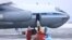 Medical personnel prepare to help Russian travelers transported from China aboard a Russian military plane at an airport outside Tyumen on February 5.