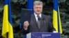 Ukrainian President Petro Poroshenko displays the fully ratified Association Agreement between Ukraine and the European Union in Kyiv on July 13.