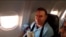 An image grab from a video released by state-run Iran Press news agency on July 24, 2020, reportedly shows a passenger with blood dripping on his face, on an Iranian passenger plane after it was intercepted by a US F-15 while flying over Syria.