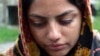 BOSNIA-HERZEGOVINA -- A woman from Afghanistan cries in the village of Bosanska Bojna, May 22, 2021
