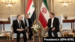 Iranian First Vice-President Es'haq Jahangiri (R) and Syrian Prime Minister Imad Khamis attend a meeting in Tehran, January 13, 2020. 