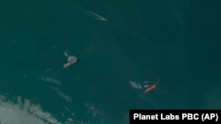 A satellite image from Planet Labs PBC shows the detained oil tankers the Niovi (left) and Advantage Sweet off the coast of Bandar Abbas, Iran, on May 6. 