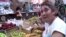 Armenia -- A trader at an agricultural market in Yerevan, 7July 2010.