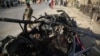 The aftermath of a roadside bomb blast that killed six civilians on the outskirts of Jalalabad on July 21.