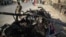 The aftermath of a roadside bomb blast that killed six civilians on the outskirts of Jalalabad on July 21.